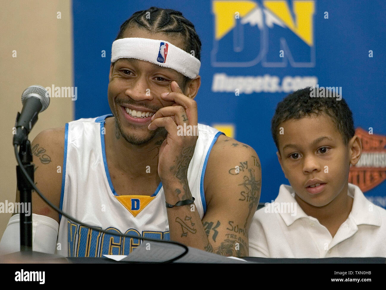 Denver Nuggets Allen Iverson (L) and his son, Allen II (Duece), appear  before the media after his debut for the Denver Nuggets at the Pepsi Center  in Denver December 22, 2006. Sacramento