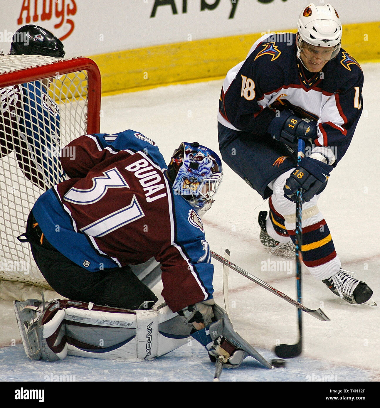 Atlanta Thrashers right wing Marian Hossa (R) of Slovakia attempts a shot against Colorado Avalalnche goalie Peter Budaj (L) of Slovakia in the second period at the Pepsi Center in Denver February 8, 2007.   (UPI Photo/Gary C. Caskey) Stock Photo