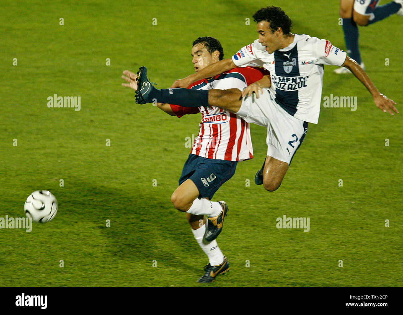 CF Pachuca defender Leobardo Lopez leaps to stop a rush by CD Guadalajara forward Omar Bravo in the second half at Dick's Sporting Goods Park in Commerce City, Colorado on July 31, 2007. Pachuca defeated Guadalajara 1-0 to advance to the semifinals of the 2007 SuperLiga.   (UPI Photo/Gary C. Caskey) Stock Photo