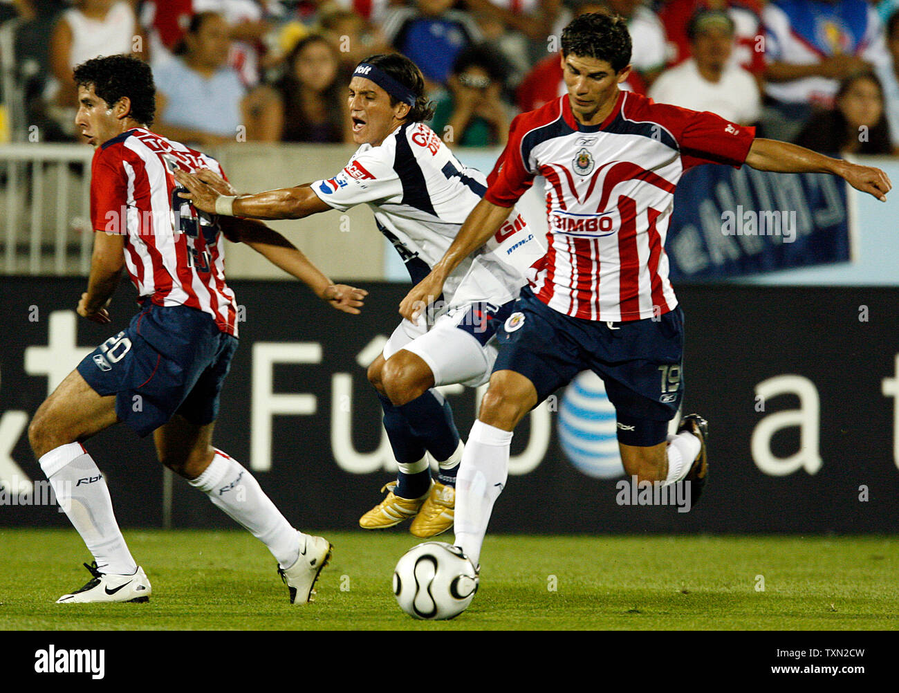 CF Pachuca forward Andres Chitiva (C) loses the ball between two CD Guadalajara defenders Edgar Mejia (L) and Jonny Magallon in the second half at Dick's Sporting Goods Park in Commerce City, Colorado on July 31, 2007. A Chivas win or tie over Pachuca moves the Guadalara team into the semifinals of the Superliga 2007 tournament.    (UPI Photo/Gary C. Caskey) Stock Photo