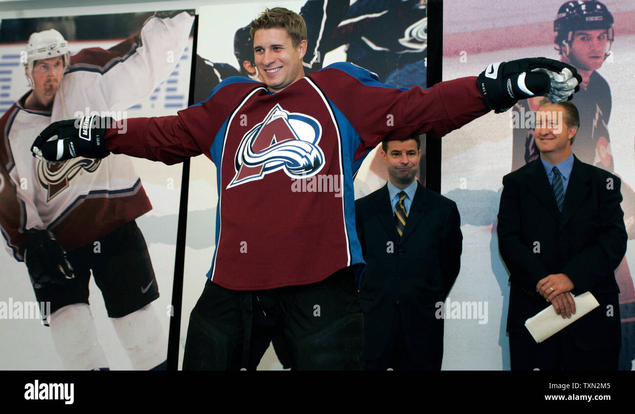 Colorado Avalanche defenseman John-Michael Liles models the new Avalanche  Reebok designed uniform against the background of past uniforms during a  press conference at the Pepsi Center in Denver on September 12, 2007.