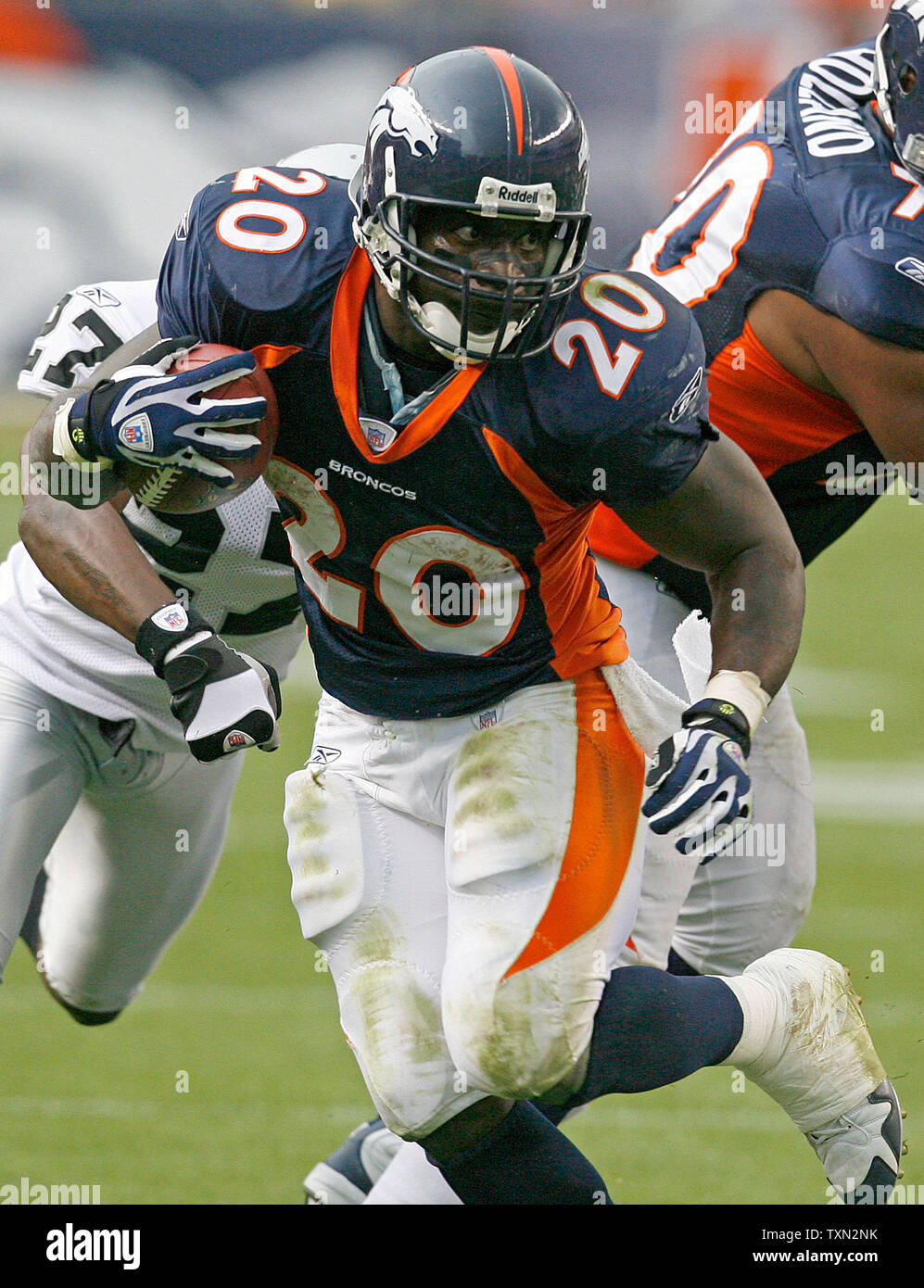 Denver Broncos' kicker Jason Elam (1) and teammate Nate Jackson