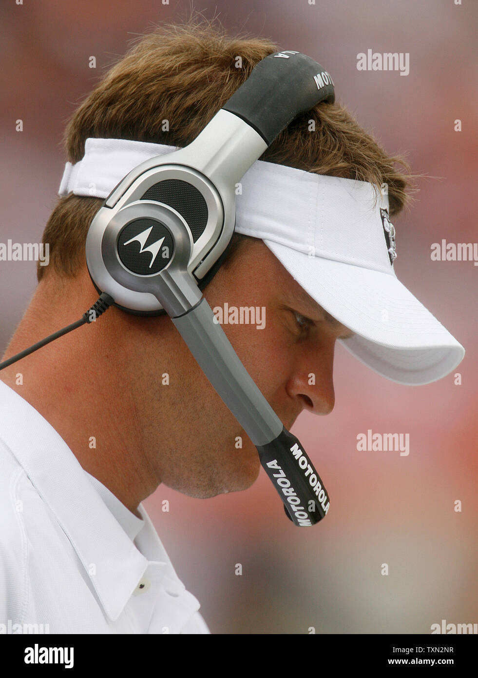 31 year old Oakland Raiders rookie head coach Lane Kiffin studies his play chart against the Denver Broncos at Invesco Field at Mile High in Denver on September 16, 2007.   Denver beat Oakland 23-20 in overtime.  (UPI Photo/Gary C. Caskey) Stock Photo