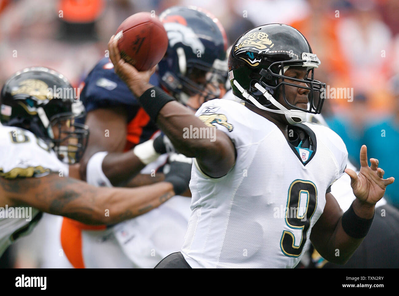 Jacksonville Jaguars QB David Garrard smiles after a play against Denver  Broncos LB Nate Webster in the second half at Invesco Field at Mile High in  Denver on September 23, 2007. Jacksonville