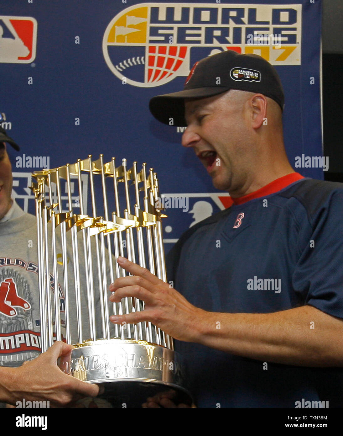 Boston Red Sox manager Terry Francona holds the World Series trophy after  the World Series game four at Coors Field in Denver on October 28, 2007.  The Boston Red Sox beat the