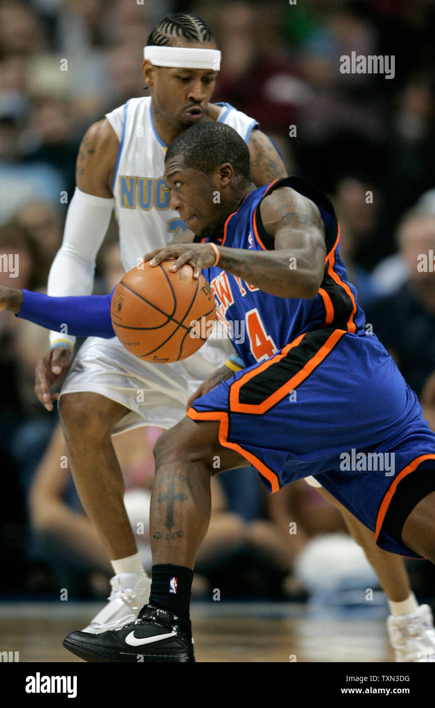 New York Knicks guard Nate Robinson (R) drives against Denver Nuggets guard Allen Iverson during the second quarter at the Pepsi Center in Denver on November 17, 2007.  (UPI Photo/Gary C. Caskey) Stock Photo