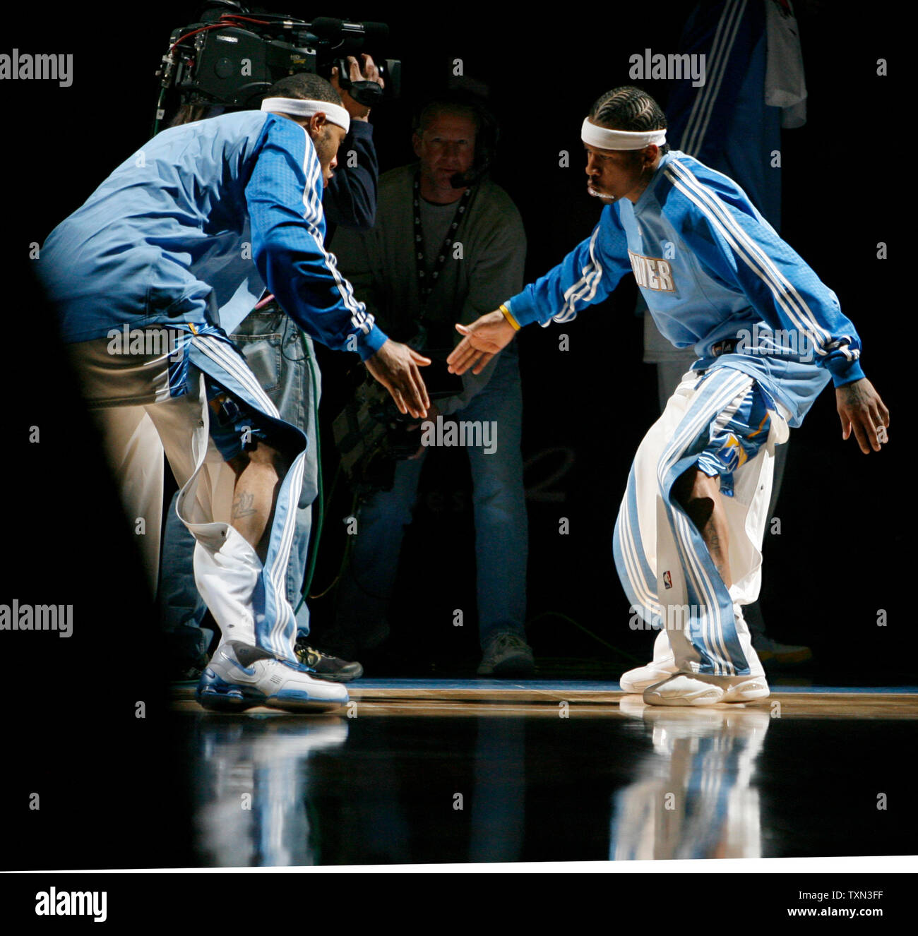 Denver Nuggets guard Allen Iverson (R) low-fives teammate Kenyon Martin during team introduction before playing the Chicago Bulls at the Pepsi Center in Denver on November 20, 2007.  Denver beat Chicago 112-91.   (UPI Photo/Gary C. Caskey) Stock Photo