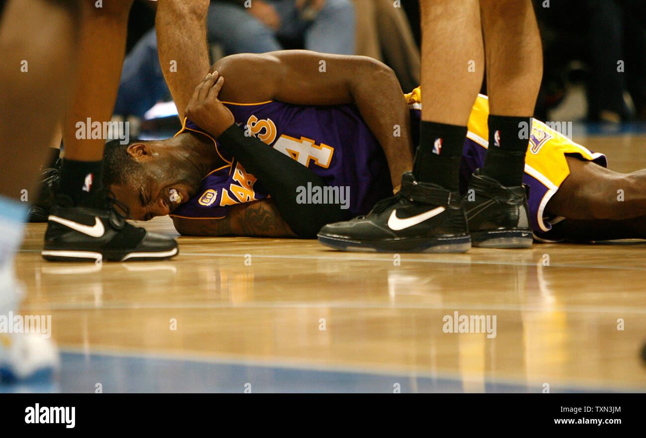 Los Angeles Lakers Guard Kobe Bryant Grimaces After Injuring