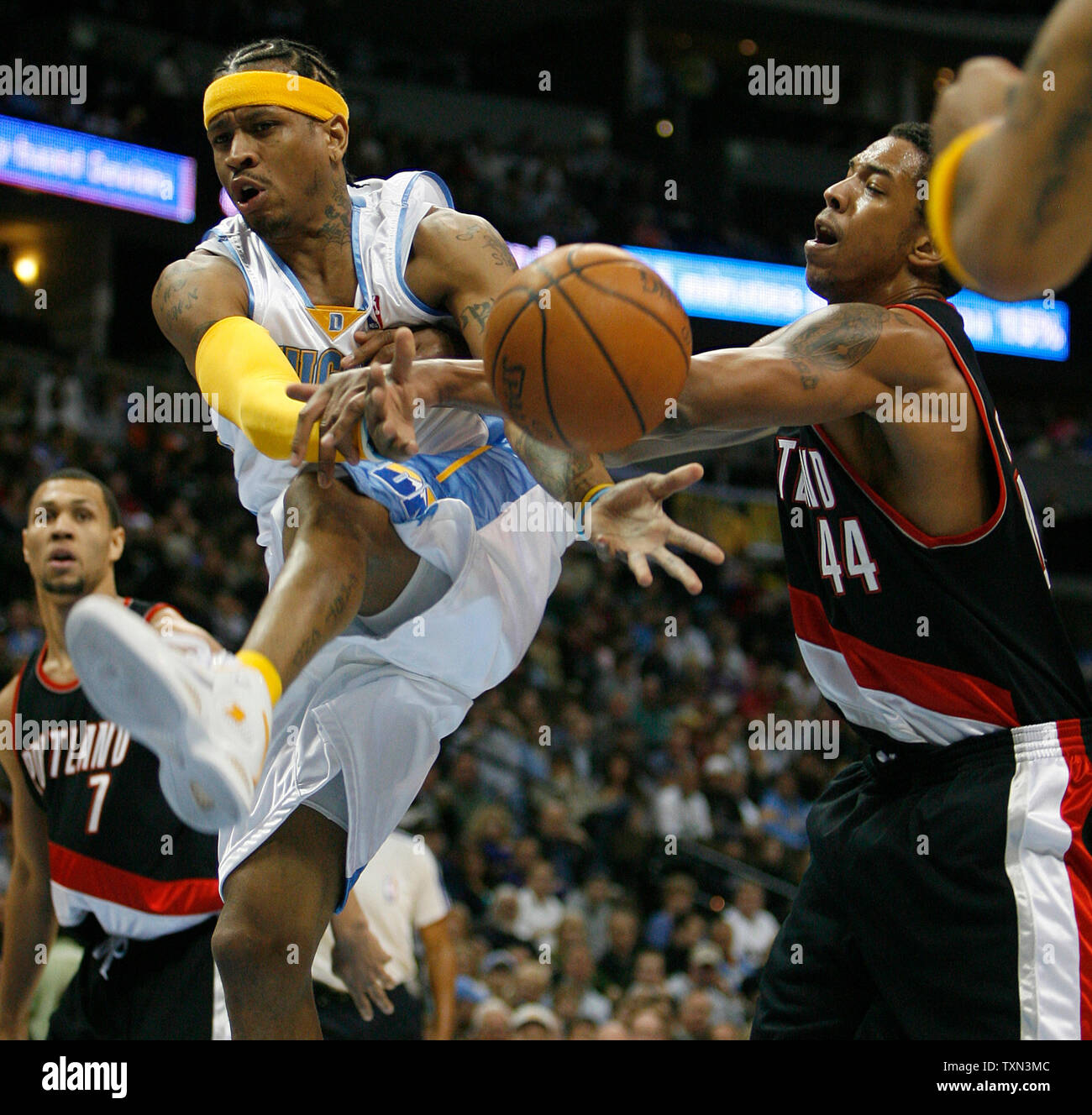 Portland Trail Blazers forward Channing Frye (R) fouls Denver Nuggets guard Allen Iverson on a drive to the basket during the first quarter at the Pepsi Center in Denver on December 16, 2007.   (UPI Photo/Gary C. Caskey) Stock Photo