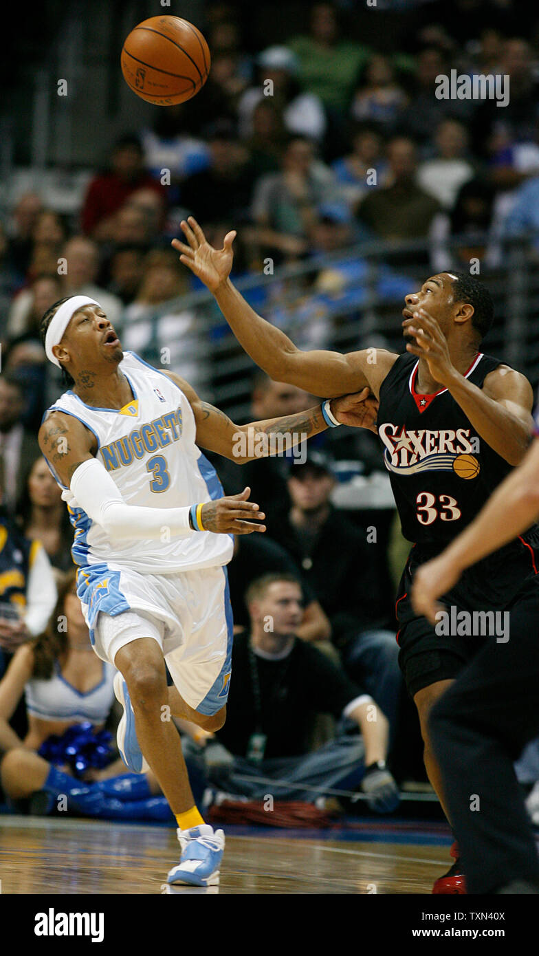 Denver Nuggets guard Allen Iverson (C) drives past Philadelphia 76ers guard  Willie Green (33) and forward Andre Iguodala during the first quarter at  the Pepsi Center in Denver on January 6, 2008. (