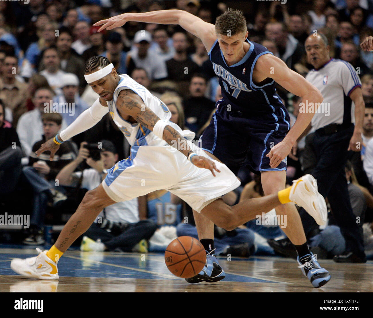 Utah Jazz forward Andrei Kirilenko (R) knocks the ball away from Denver Nuggets guard Allen Iverson during the first quarter at the Pepsi Center in Denver on February 6, 2008.   (UPI Photo/Gary C. Caskey) Stock Photo