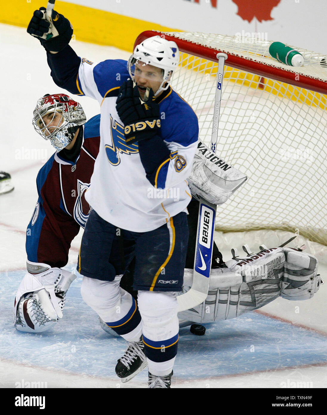 St. Louis Blues center Jay McClement celebrates teammate's goal in front of Colorado Avalanche goalie Jose Theodore during the first period at the Pepsi Center in Denver on February 14, 2008.  (UPI Photo/Gary C. Caskey) Stock Photo