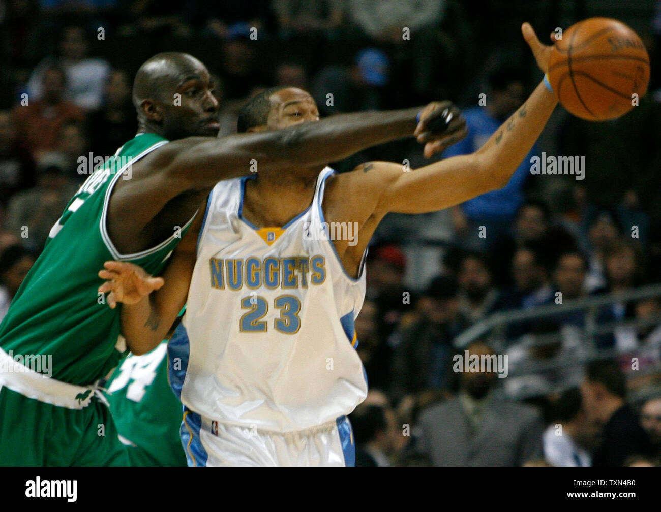 Boston Celtics forward Kevin Garnett (L) forces Denver Nuggets guard Allen  Iverson to pass off on a drive to the basket in the second half at the  Pepsi Center in Denver on