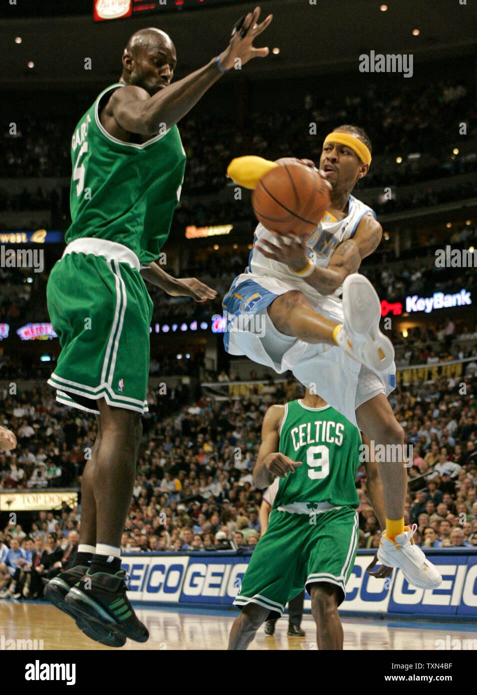 Boston Celtics forward Kevin Garnett (L) forces Denver Nuggets guard Allen  Iverson to pass off on a drive to the basket in the second half at the  Pepsi Center in Denver on