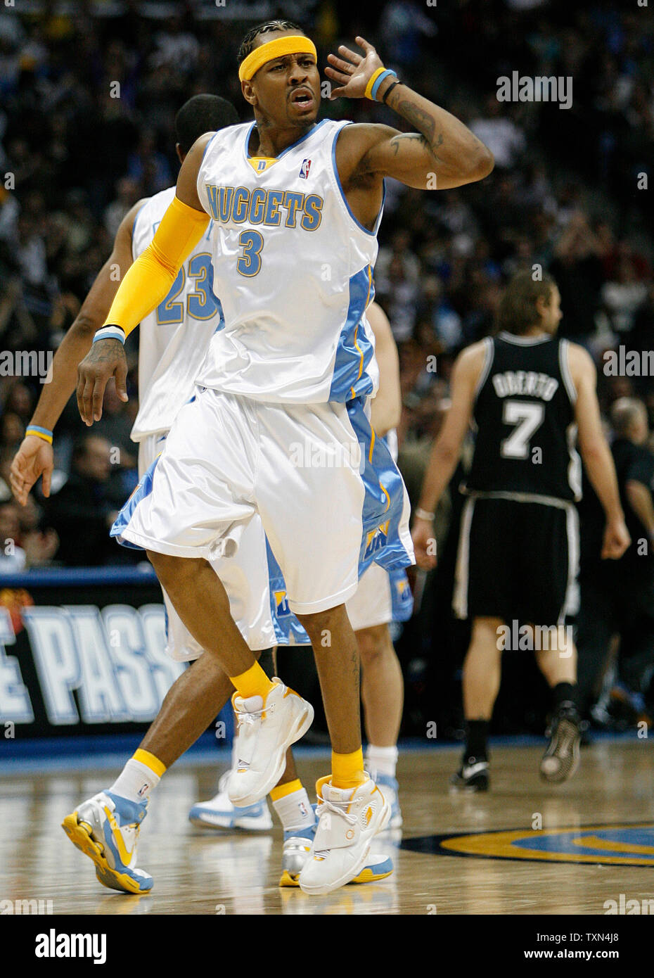 Denver Nuggets Allen Iverson (3) lays up two between Golden State Warriors  Baron Davis (C) and Stephen Jackson in the first half at Oracle Arena in  Oakland, California on April 10, 2008.