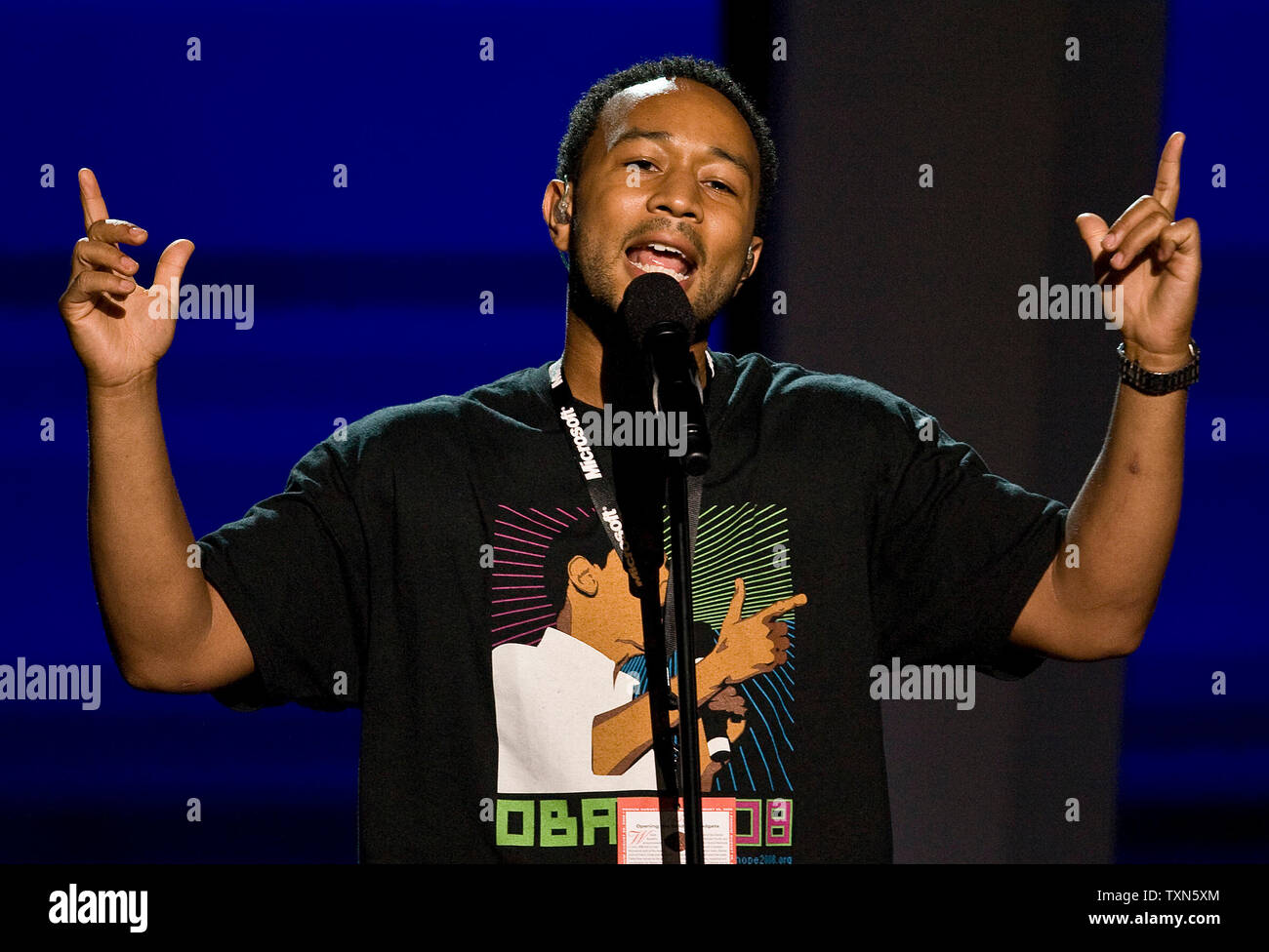 Singer John Legend Practices At The Podium For His Performance On The First Day Of The