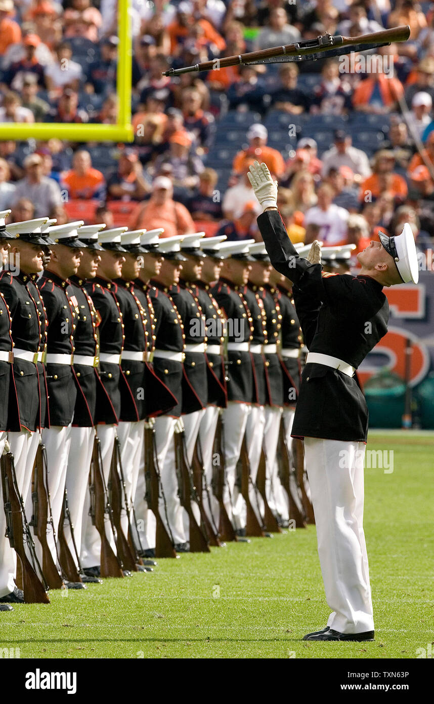 The United States Marine Corps Silent Drill Platoon performs during halftime of the New Orleans Saints-Denver Broncos game at Invesco Field at Mile High in Denver on September 21, 2008.  Denver held off New Orleans winning 34-32.  (Photo by Gary C. Caskey) Stock Photo