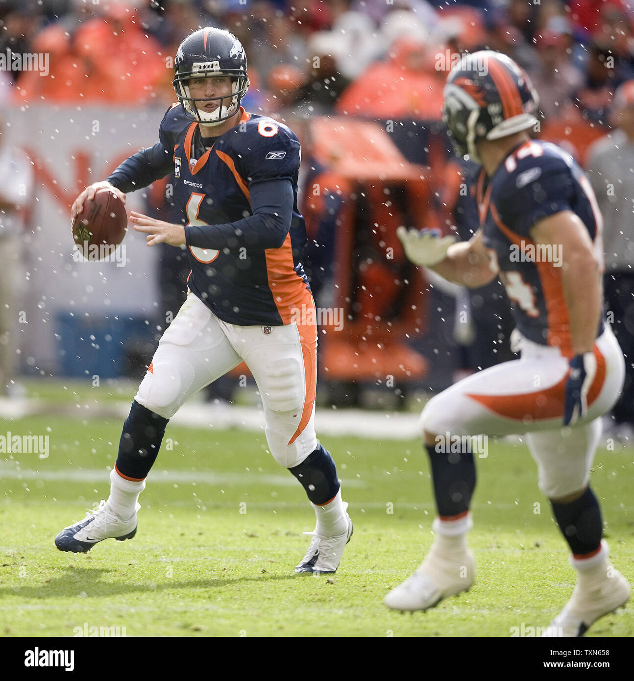 Denver Broncos quarterback Jay Cutler warms up at Invesco Field at