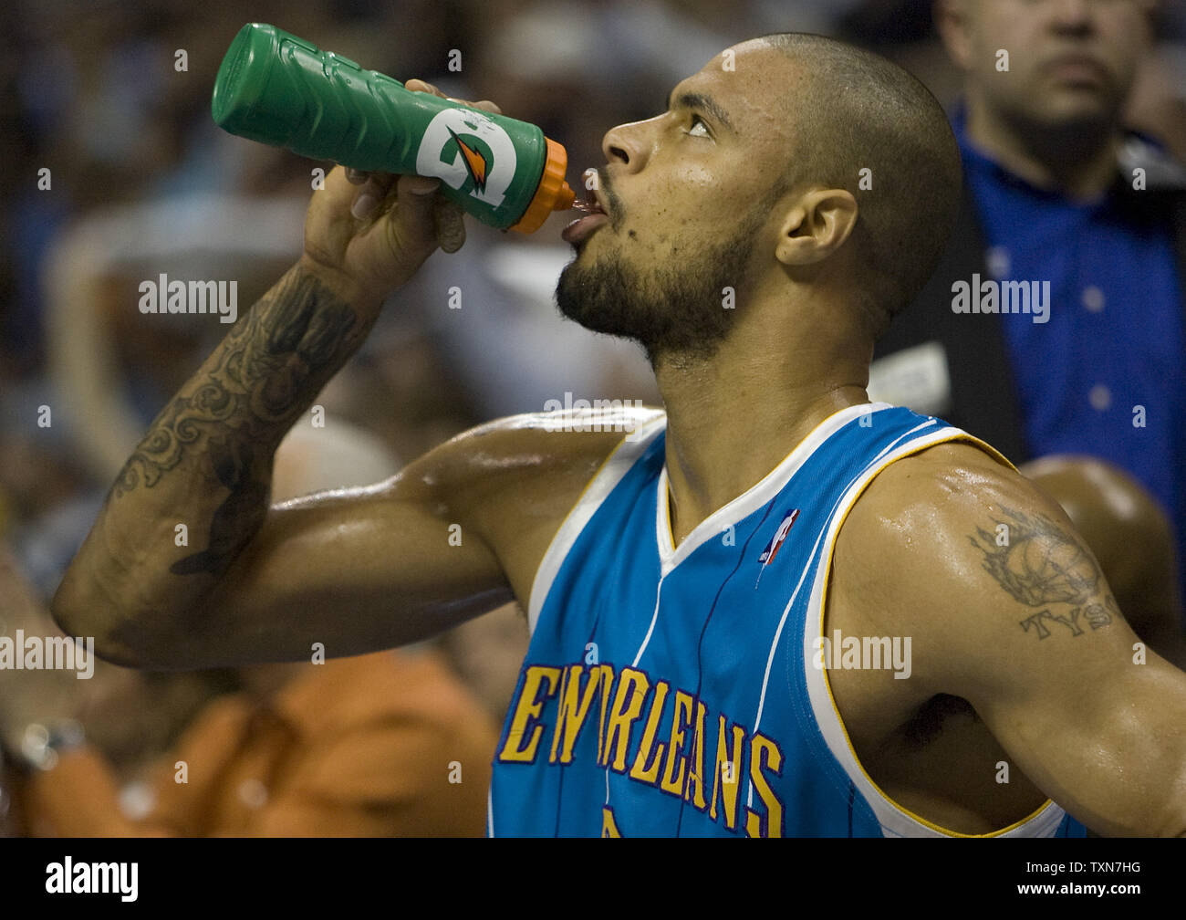 New Orleans Hornets center Tyson Chandler gulps down some water during a time out in the first quarter against the Denver Nuggets in game one of their opening round series at the Pepsi Center in Denver on April 19, 2009.    (UPI Photo/Gary C. Caskey) Stock Photo