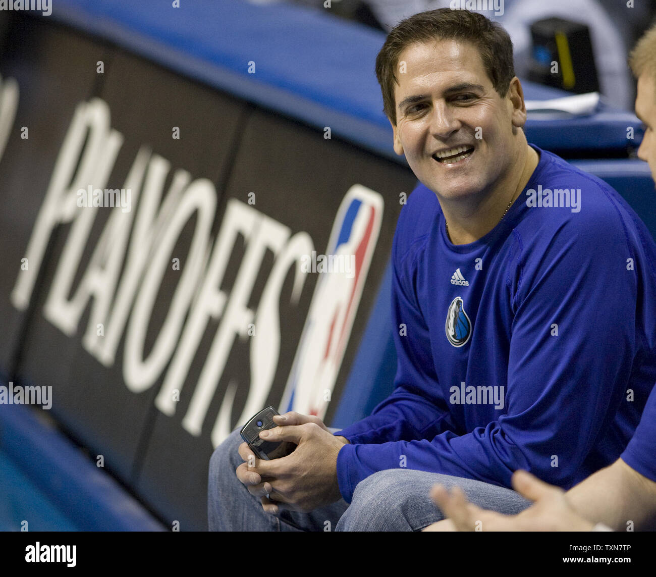 dallas-mavericks-owner-mark-cuban-watches-warm-ups-from-the-team-bench-before-game-two-of-their-western-conference-second-round-playoff-series-at-the-pepsi-center-in-denver-on-may-3-2009-denver-leads-the-series-1-0-upi-photogary-c-caskey-TXN7TP.jpg