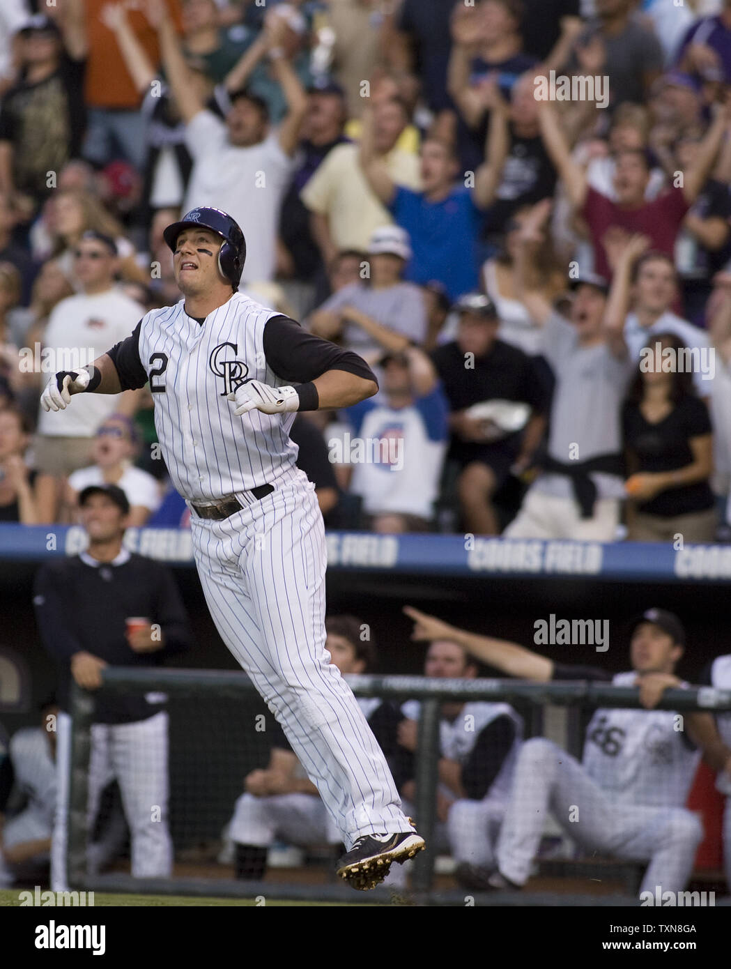 Colorado Rockies shortstop Troy Tulowitzki leaps while watching an apparent grand slam home run against the Chicago Cubs during the second inning at Coors Field in Denver on August 10, 2009.  Umpires ruled it foul but later reviewed the play only to confirm the ball was foul by a yard.       UPI/Gary C. Caskey... Stock Photo