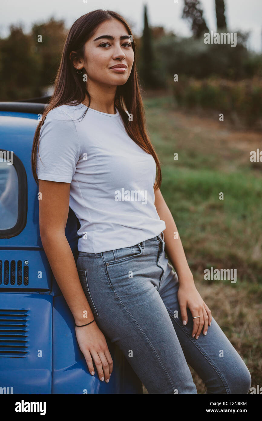 Woman leaning against car looking hi-res stock photography and images -  Alamy