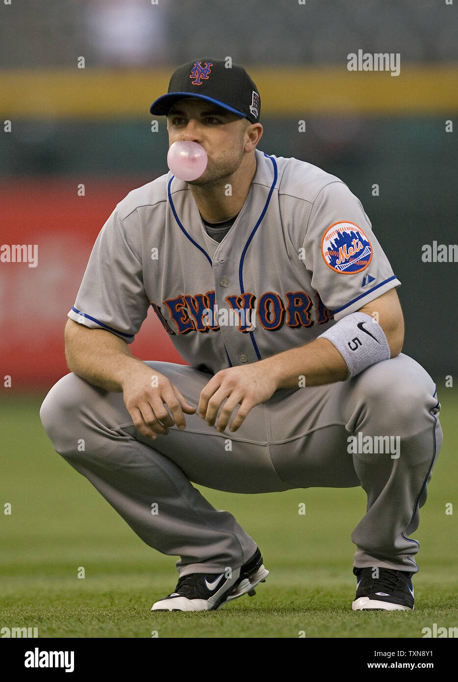 New York Mets third baseman David Wright squats during pre-game warm ups at  Coors Field in Denver on September 1, 2009. Wright returned to the lineup  after returning from the 15-day disabled