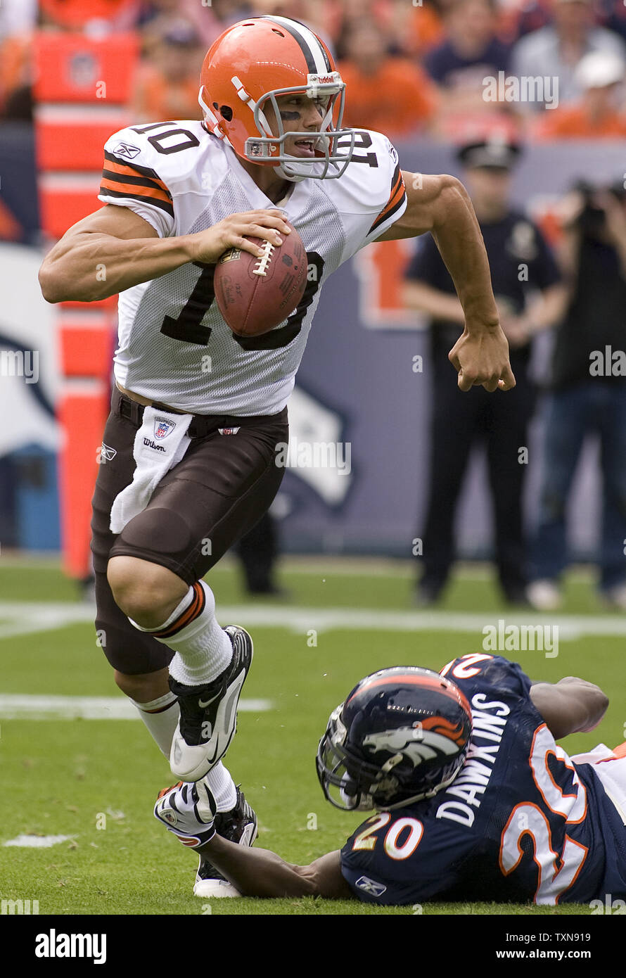 Cleveland Browns quarterback Brady Quinn (10) escapes a safety blitz during the first half against Denver Broncos Brian Dawkins at Invesco Field at Mile High in Denver on September 20, 2009.l  Denver defeated Cleveland 27-6 in their NFL home opener.   UPI/Gary C. Caskey... Stock Photo