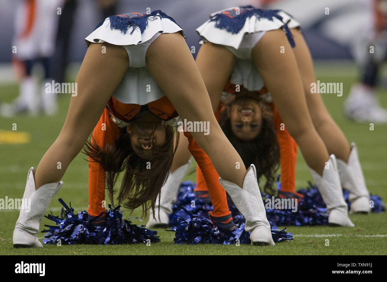 Denver Broncos cheerleaders perform during a timeout at Invesco Field at Mile High in Denver on September 20, 2009.  Denver defeats Cleveland 27-6 in their NFL home opener.   UPI/Gary C. Caskey... Stock Photo