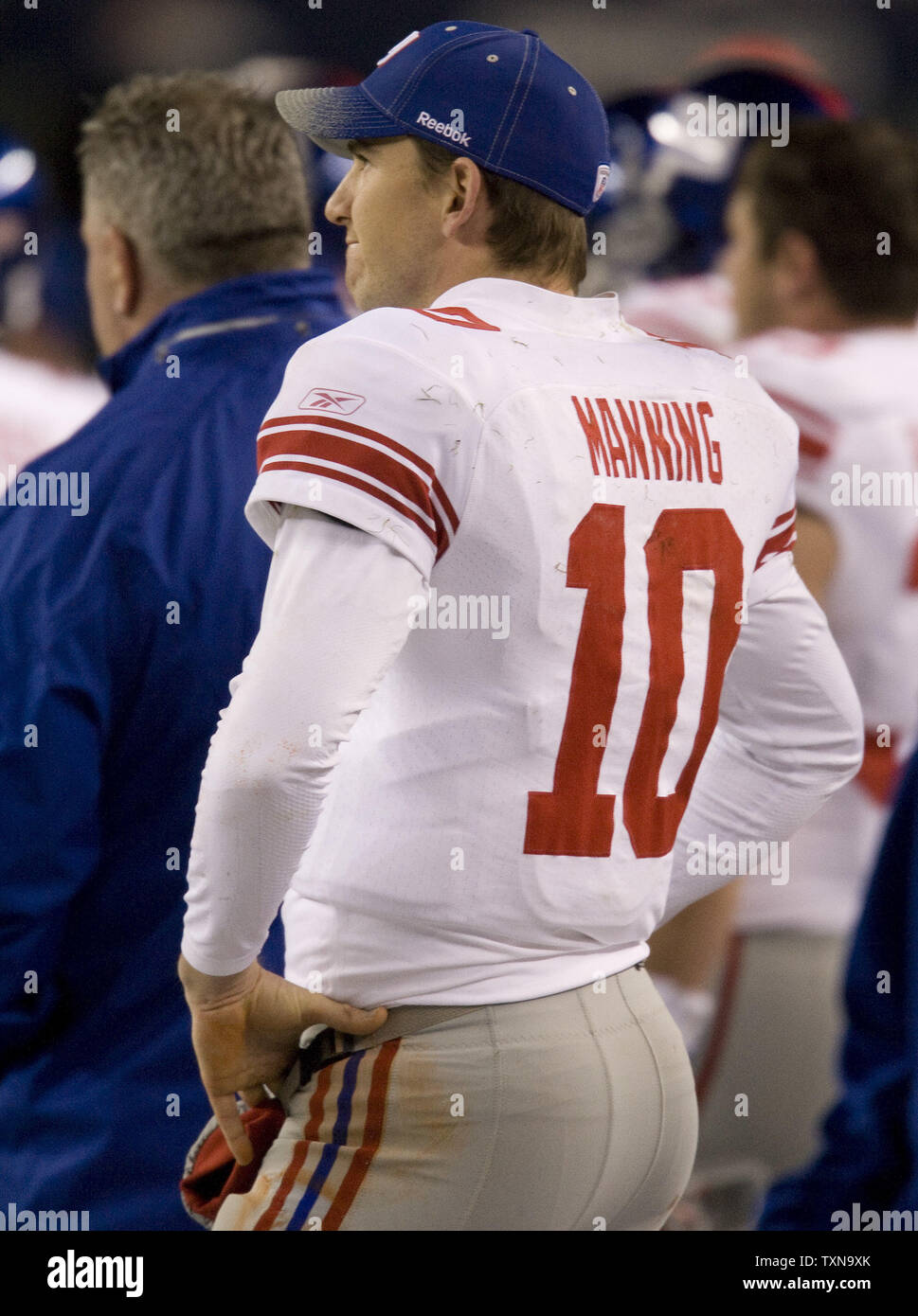 New York Giants quarterback watches play in the closing seconds against the Denver Broncos during the second quarter at Invesco Field at Mile High in Denver on November 26, 2009.    UPI/Gary C. Caskey... Stock Photo