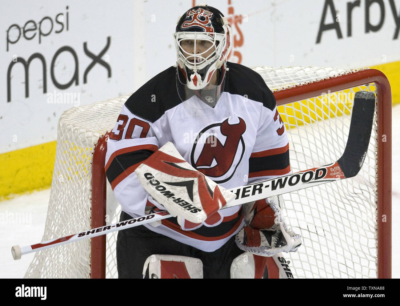 New Jersey Devils goalie Martin Brodeur watches the puck during third period action against the Colorado Avalanche at the Pepsi Center in Denver on January 16, 2010.  Colorado beat New Jersey 3-1.      UPI/Gary C. Caskey.. Stock Photo