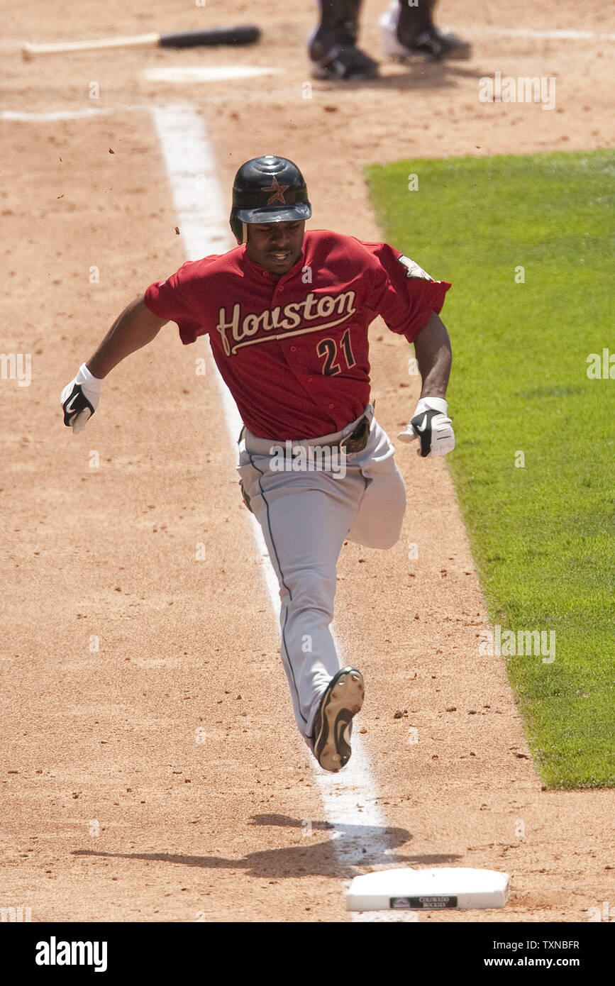 Houston Astros center fielder Michael Bourn catches a fly ball on
