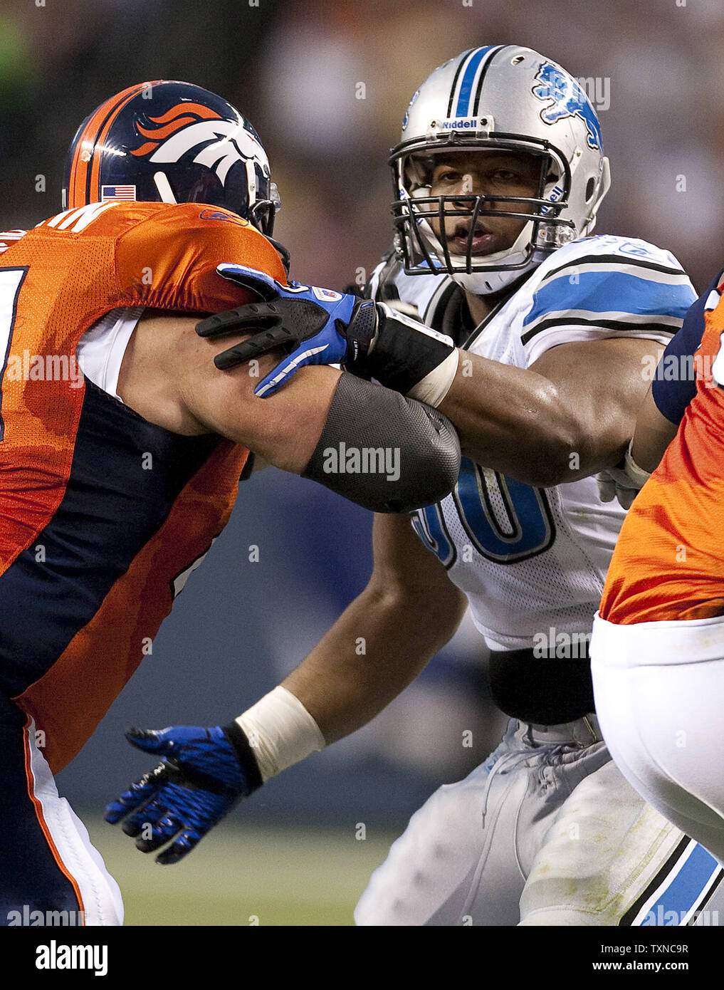 Detroit Lions Defensive Tackle Ndamukong Suh Fends Off Denver