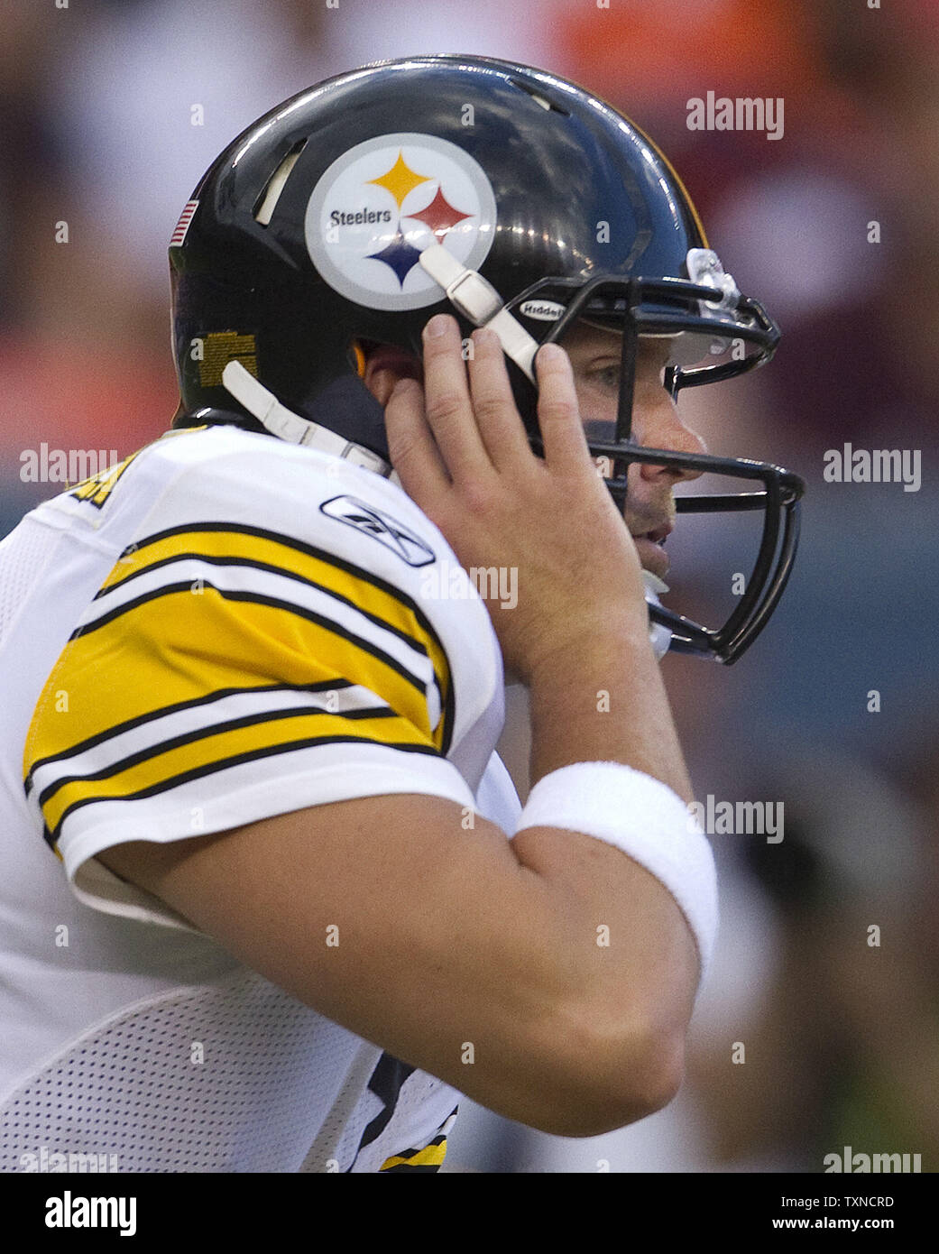 Pittsburgh Steelers quarterback Ben Roethlisberger tries to hear a play call during the first quarter against the Denver Broncos at Invesco Field at Mile High on August 29, 2010 in Denver.  UPI/Gary C. Caskey Stock Photo