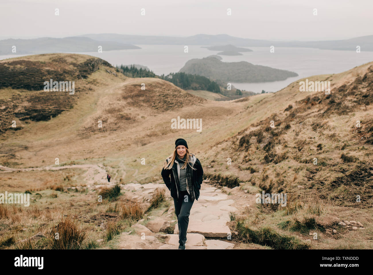 Trekker, Loch Lomond in background, Trossachs National Park, Canada Stock Photo