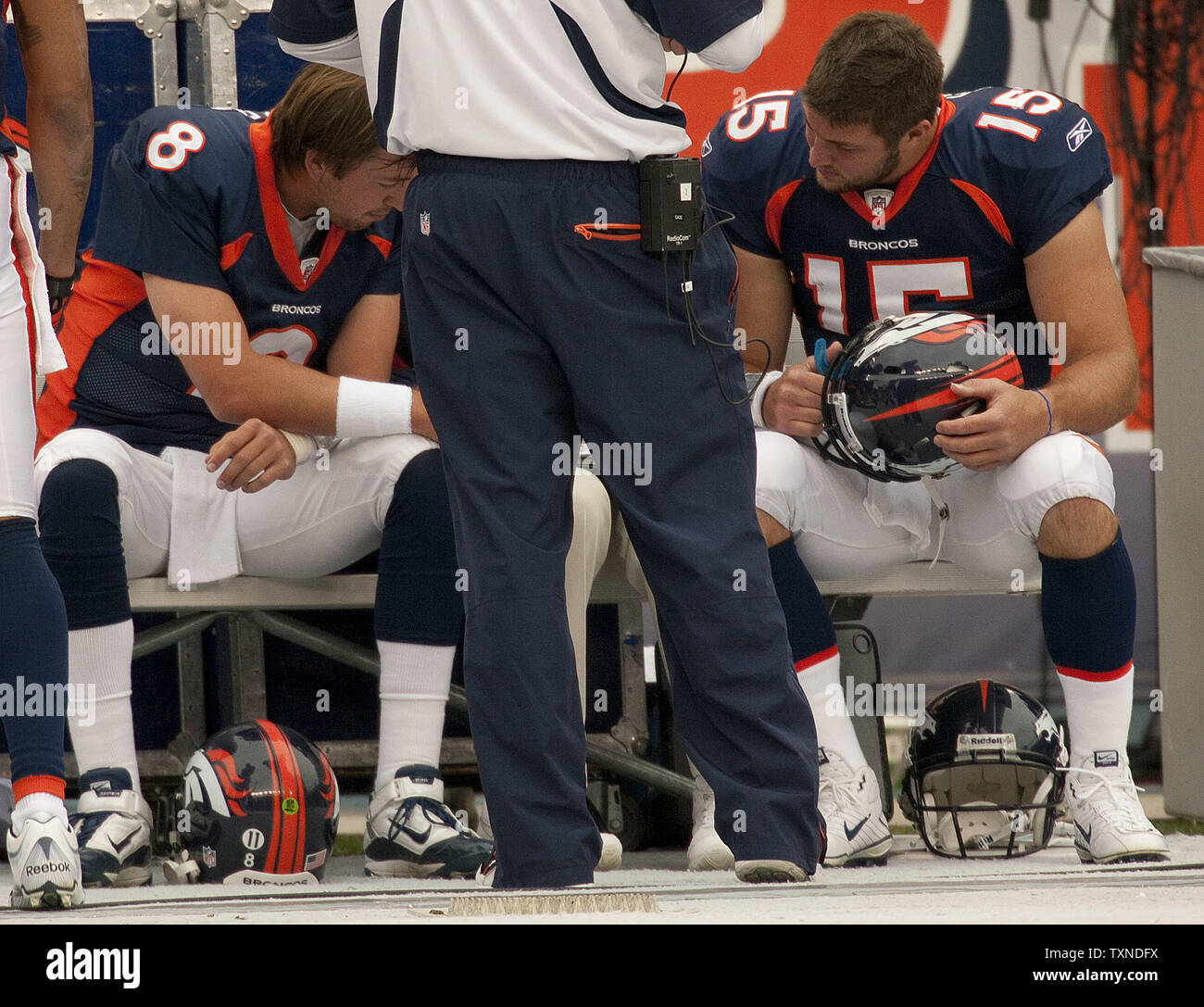 Denver Broncos quarterbacks Kyle Orton (8) and Tim Tebow (15) look at game photos during the first quarter at Invesco Field at Mile High on October 24, 2010 in Denver.           UPI/Gary C. Caskey Stock Photo