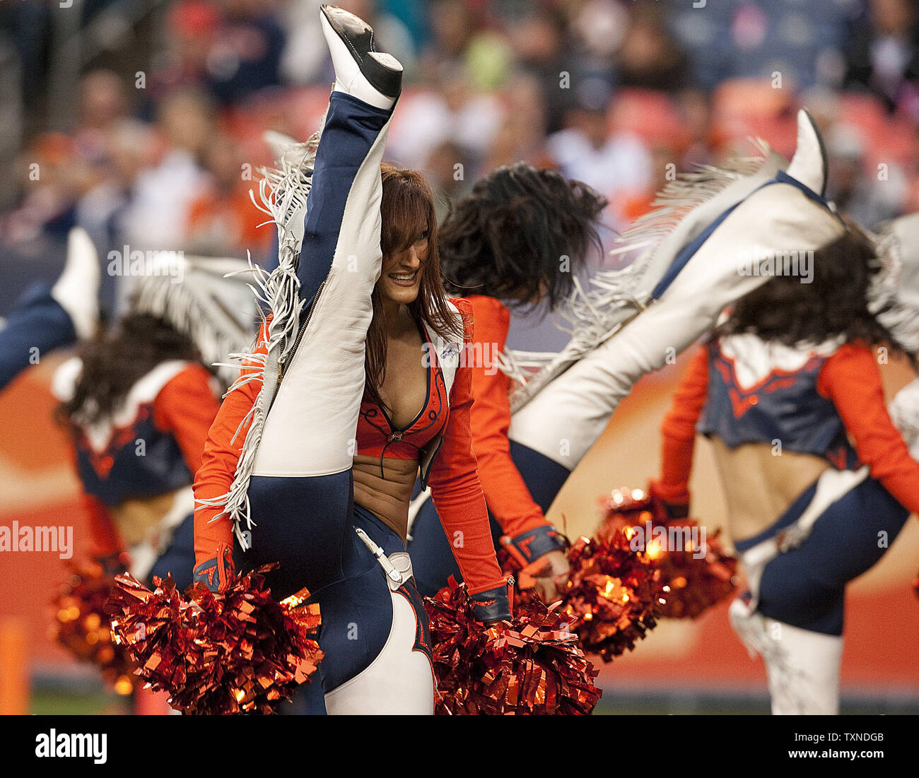 The Denver Broncos cheerleaders perform between quarters during the second half against the Oakland Raiders at Invesco Field at Mile High on October 24, 2010 in Denver.   The Raiders decimated the Broncos 59-14.         UPI/Gary C. Caskey Stock Photo