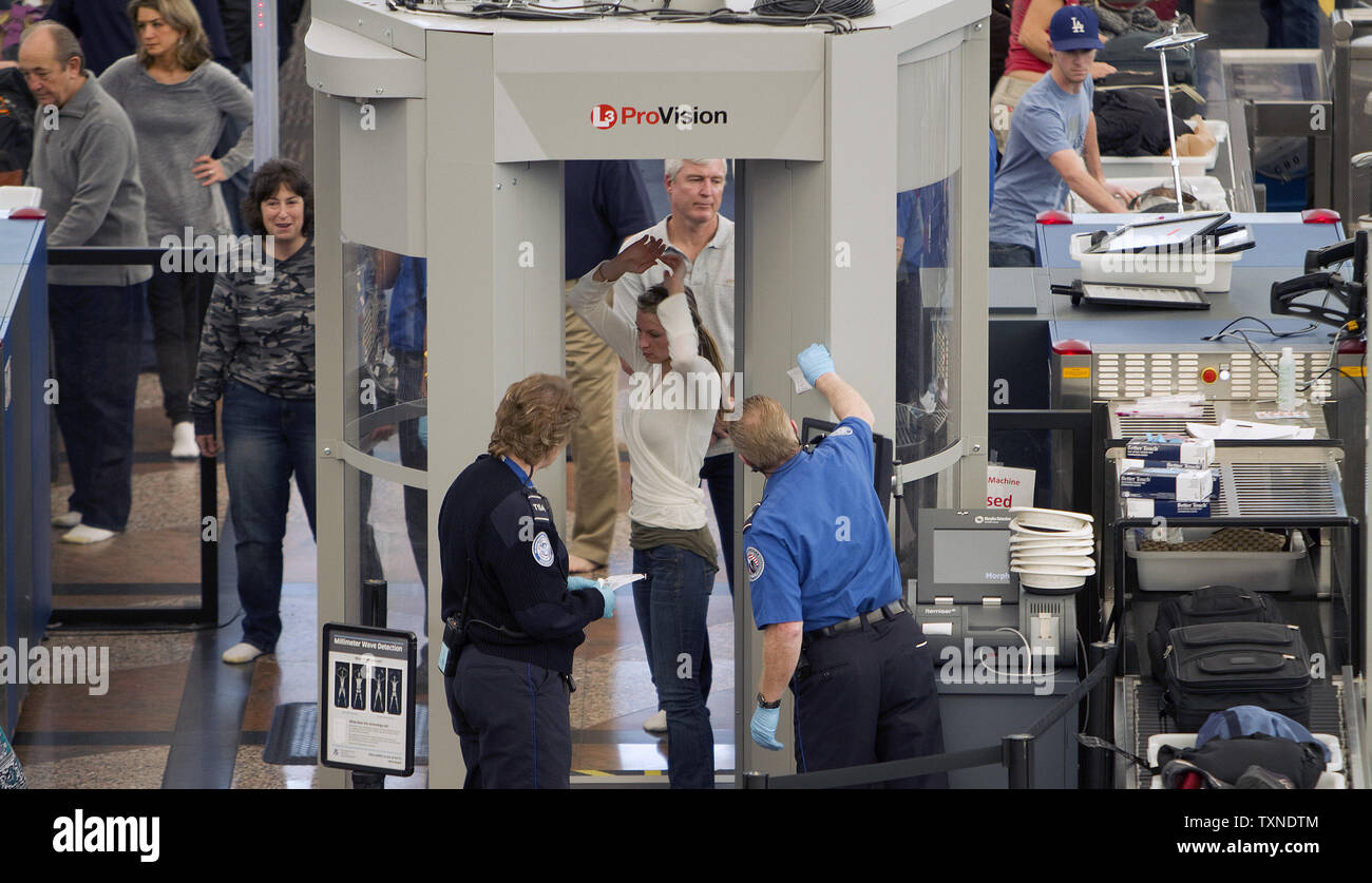 https://c8.alamy.com/comp/TXNDTM/transportation-security-administration-tsa-agents-conduct-full-body-scans-at-denver-international-airport-dia-the-day-before-the-thanksgiving-holiday-on-november-24-2010-in-denver-dia-officials-expect-a-record-number-of-passengers-to-pass-through-the-airport-a-passenger-boycott-of-the-full-body-scanners-did-not-appear-to-materialize-at-dia-upigary-c-caskey-TXNDTM.jpg