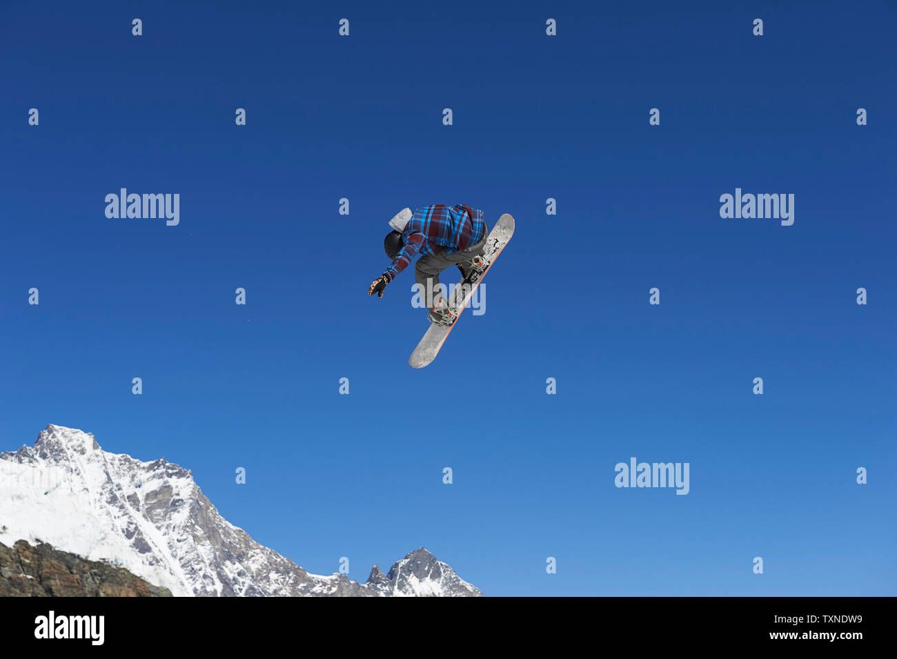 Skier in midair, Saas-Fee, Valais, Switzerland Stock Photo