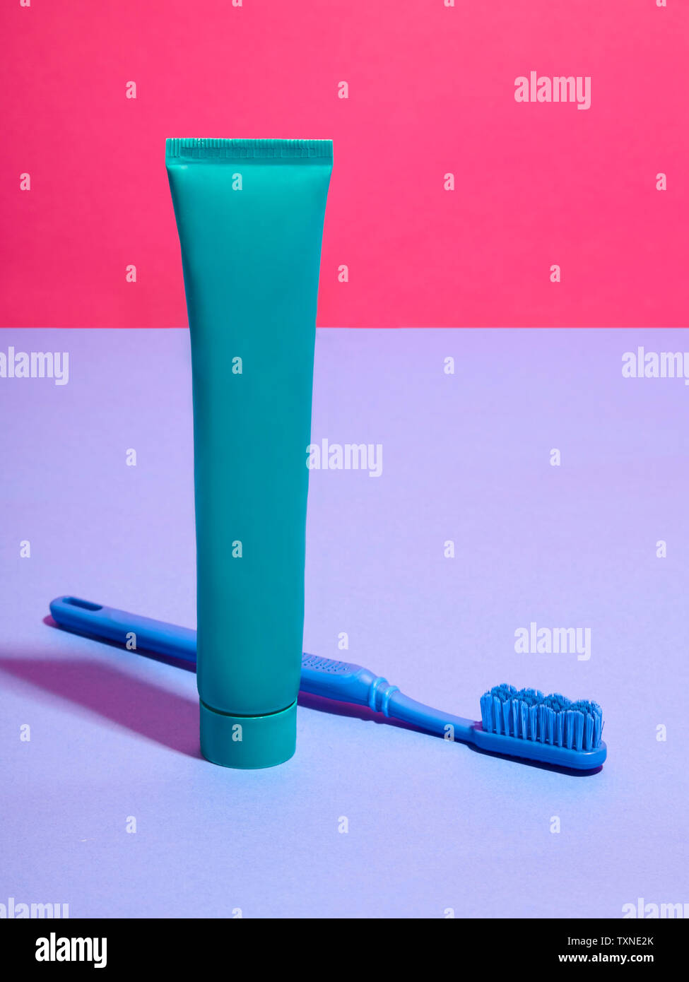 Toothbrush toothpaste blue background hires stock photography and