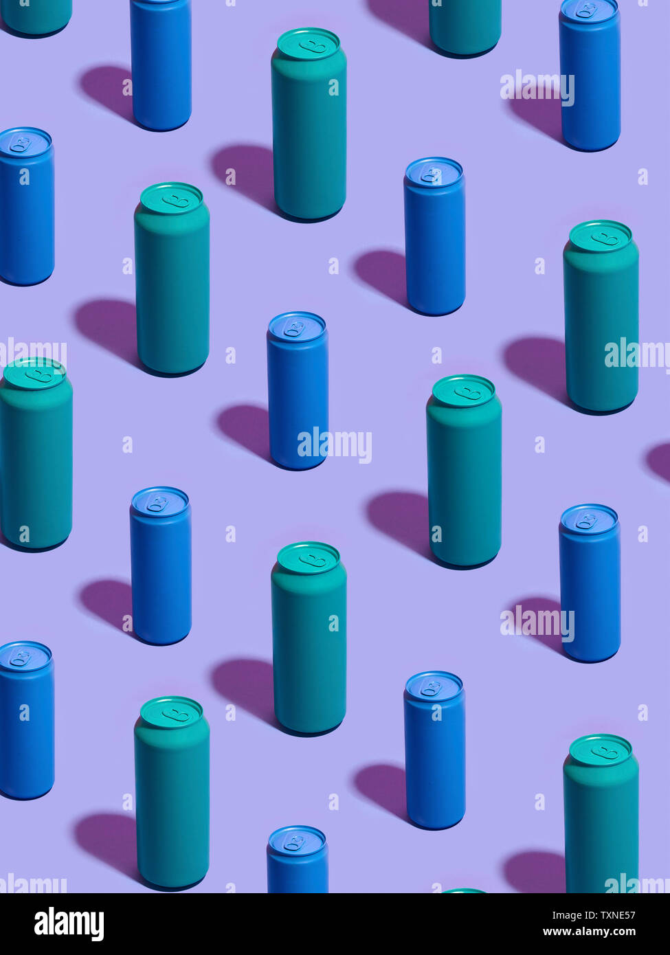 Still life of turquoise and blue drink cans in diagonal rows on purple background Stock Photo