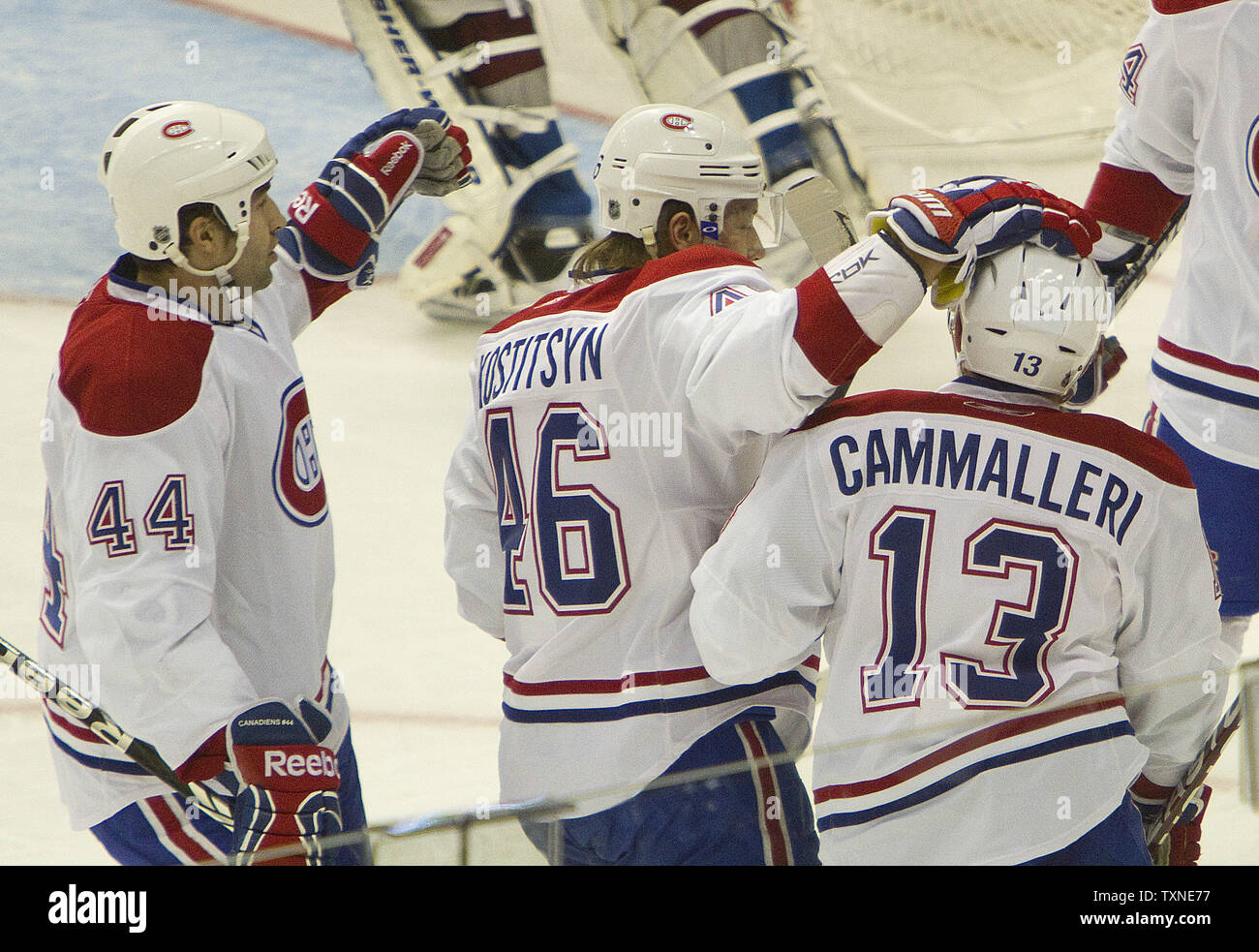 Montreal Canadiens Roman Hamrlik (44) and Andrei Kostitsyn congratulate teammate Michael Cammalleri after his first period goal against the Colorado Avalache at the Pepsi Center in Denver on December 19, 2010.  The Canadiens lead the Northeast division with the Avalanche percentage points behind the Northwest division lead.        UPI/Gary C. Caskey Stock Photo