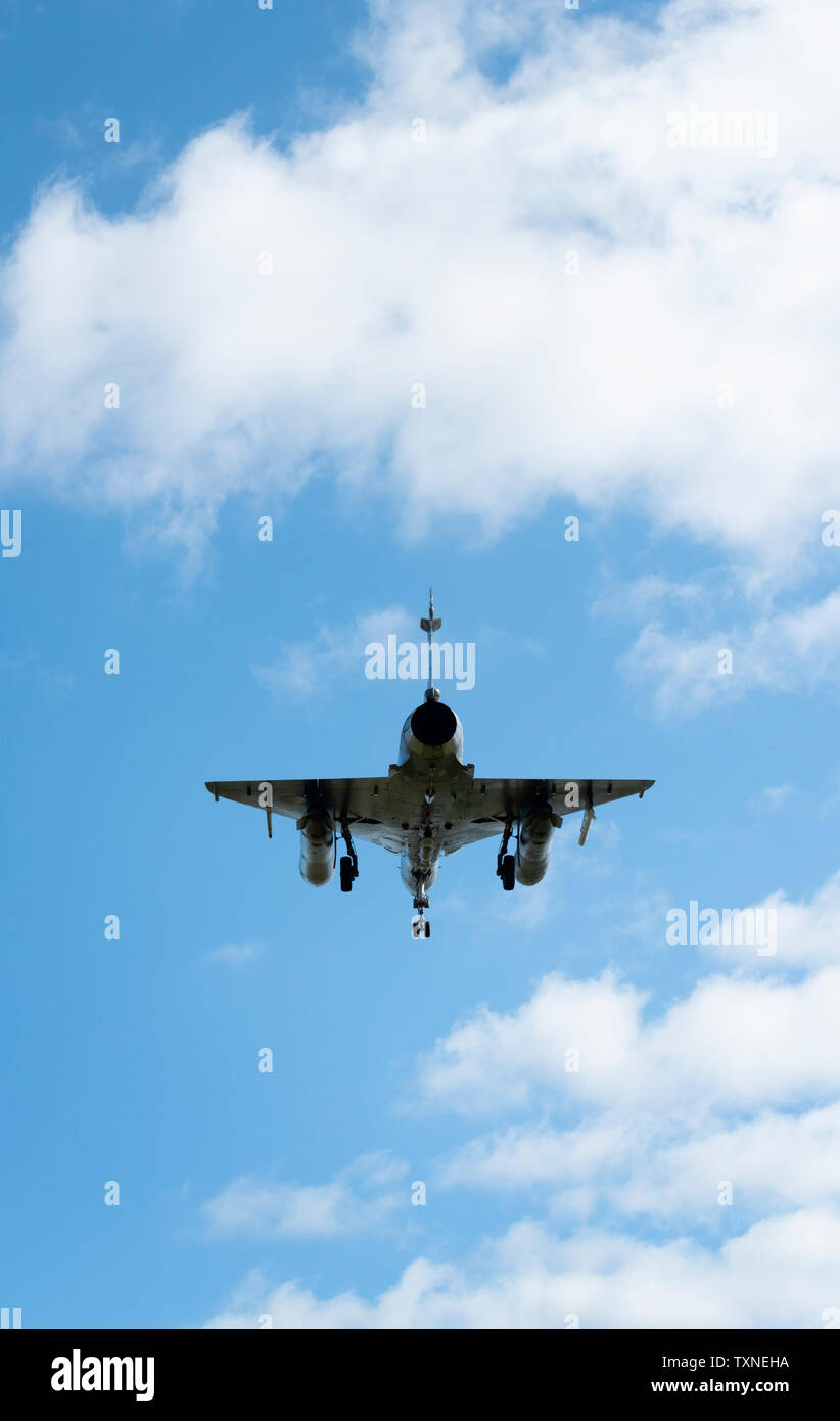 French Mirage 2000 fighter plane taking part in NATO exercise Frysian flag, low angle against blue sky, Netherlands Stock Photo