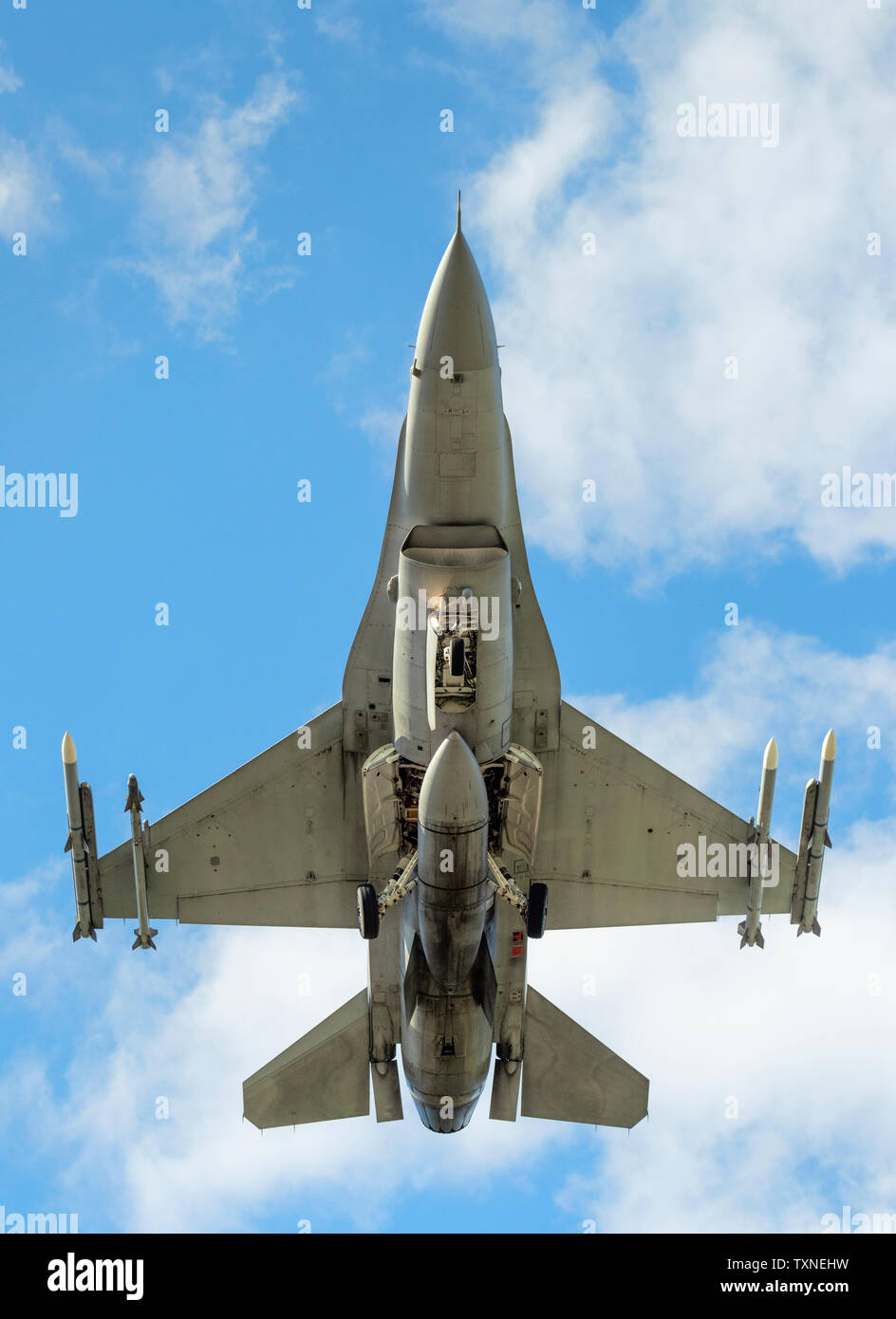 Polish F-16 fighter plane taking part in NATO exercise Frysian flag, low angle against blue sky, Netherlands Stock Photo