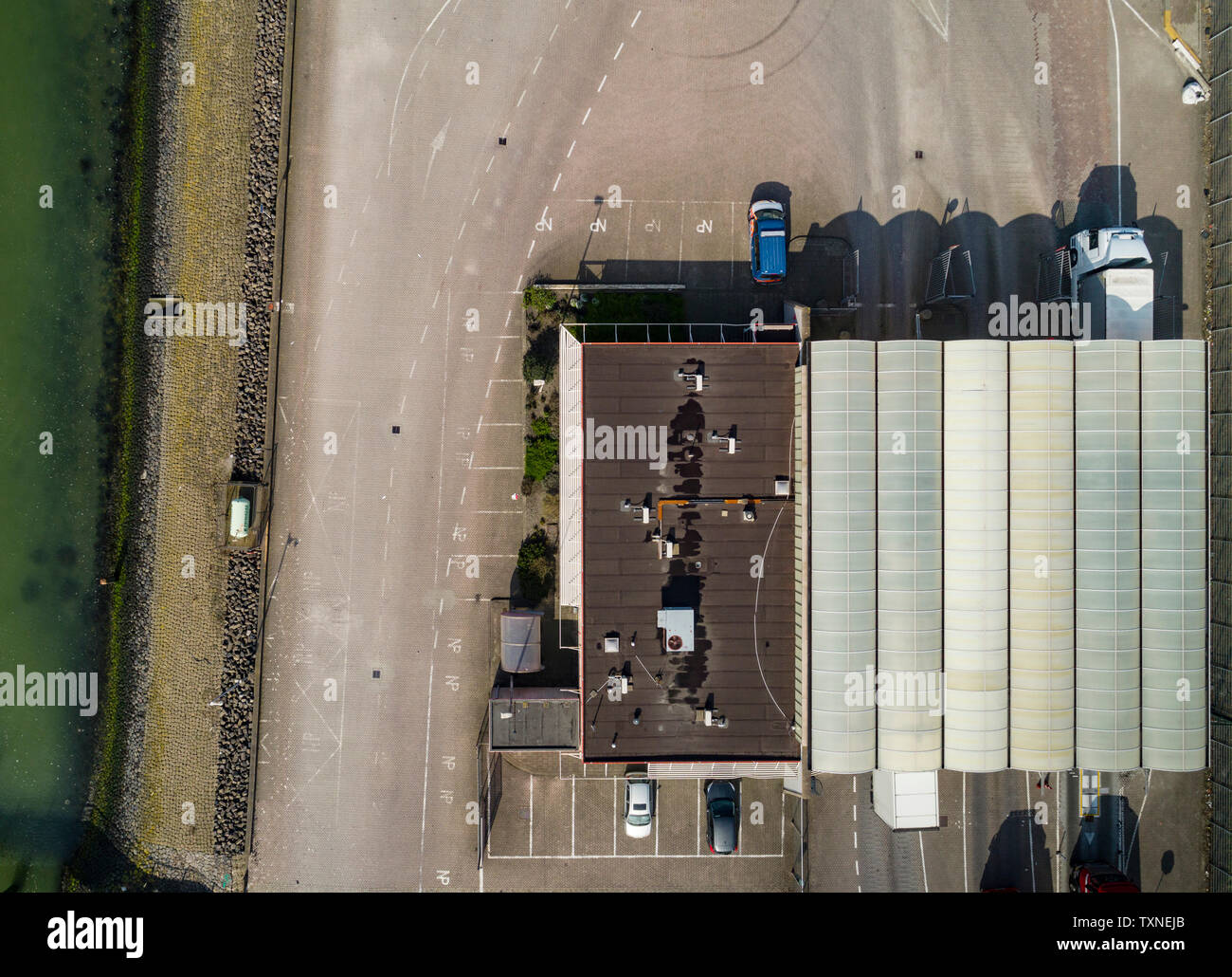 Trucks passing  customs office before ferry journey to UK, overhead view, Hook of Holland, Zuid-Holland, Netherlands Stock Photo