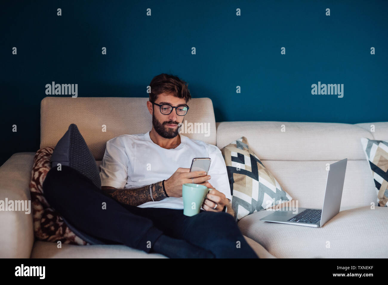 Man reclining sofa hi-res stock photography and images - Alamy