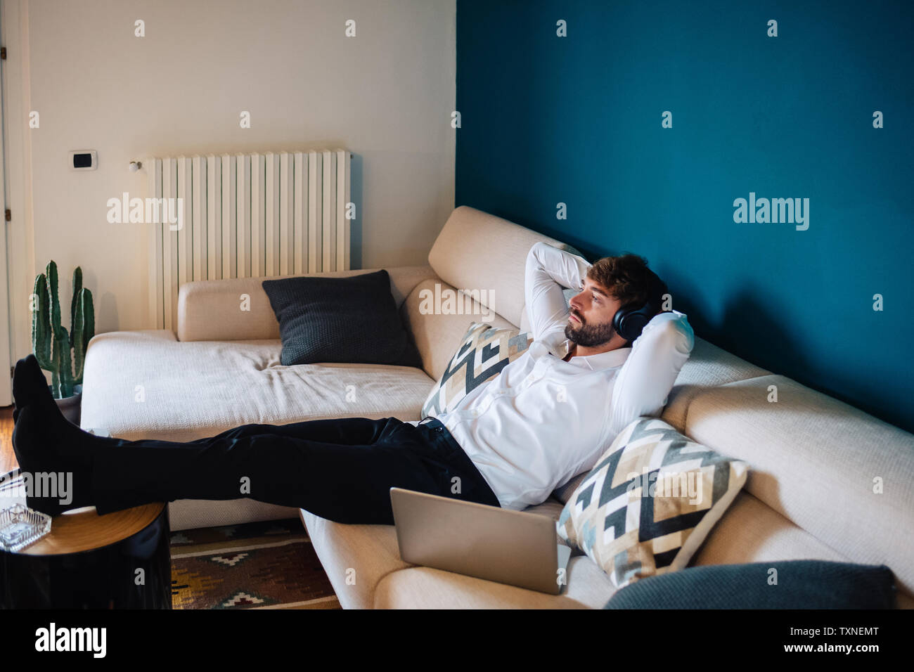 Man feet up sofa hi-res stock photography and images - Alamy