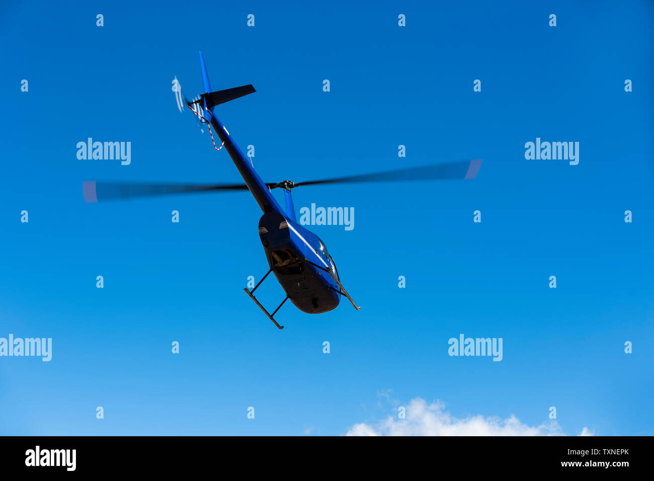 Helicopter flying against blue sky, low angle view, Cape Town, Western Cape, South Africa Stock Photo