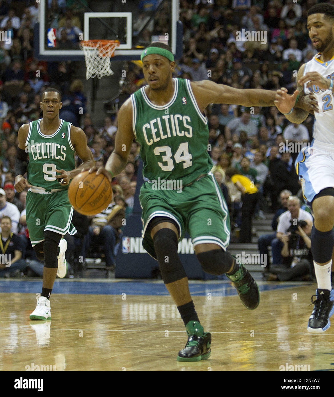 Boston Celtics forward Paul Pierce (34) pushes away Denver Nuggets forward Wilson Chandler during the fourth quarter at the Pepsi Center in Denver on February 24, 2011.    The Nuggets beat the Celtics 89-75 for their second straight win since trading star forward Carmelo Anthony.    UPI/Gary C. Caskey Stock Photo
