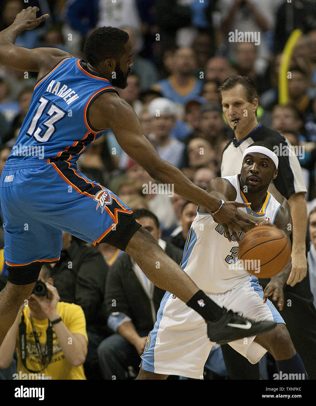 Los Angeles Lakers small forward Metta World Peace (15) throws his elbow  into Oklahoma City Thunder guard James Harden (13) in the first half of an  NBA basketball game in Los Angeles
